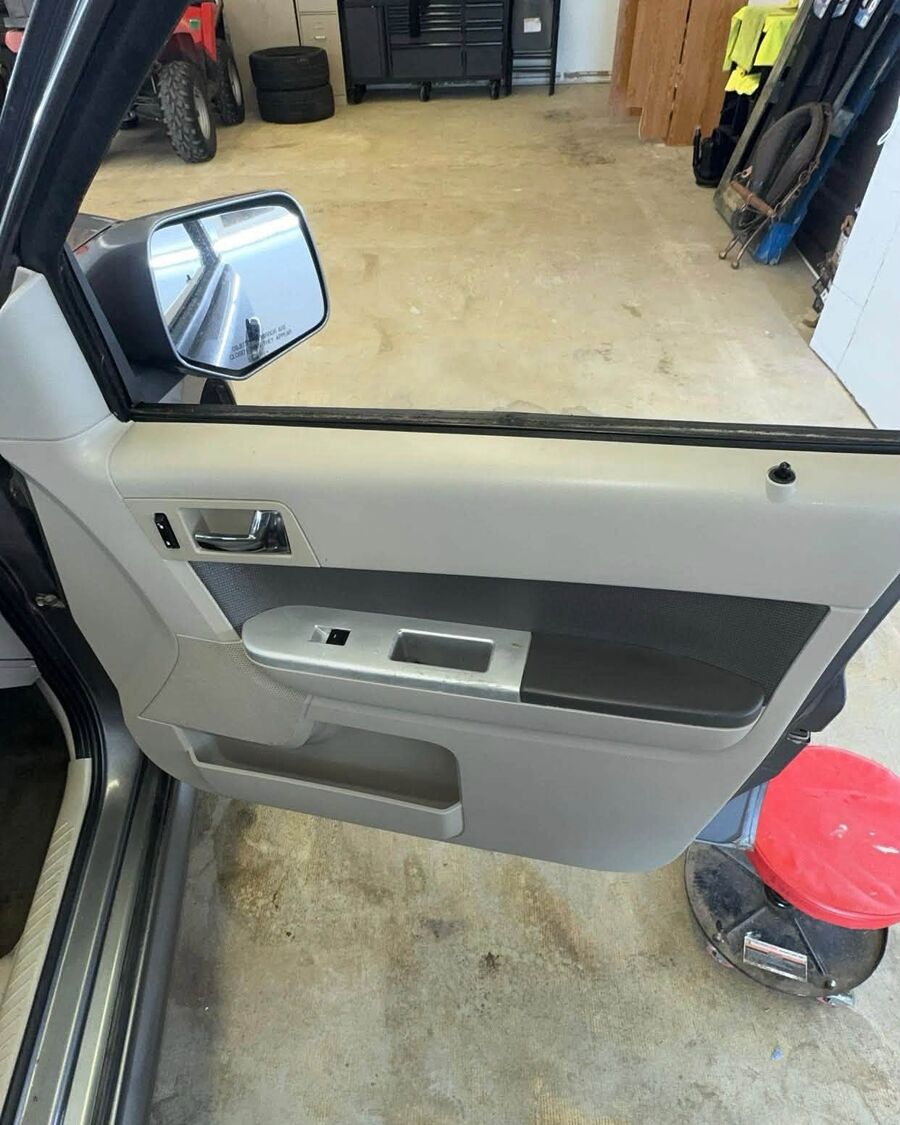 The same door panel after, wiped clean with the trim brought back